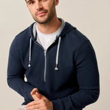 Made with our ripple knit, named for it's noticable texture, this half-zip hoodie is a formidable candidate for your new favorite layer for everything from the morning dog walk to the sports bar. Finished with high-quality hardware and an Americana-inspired red, white, and blue detail on the drawstring, this it casual style done right.