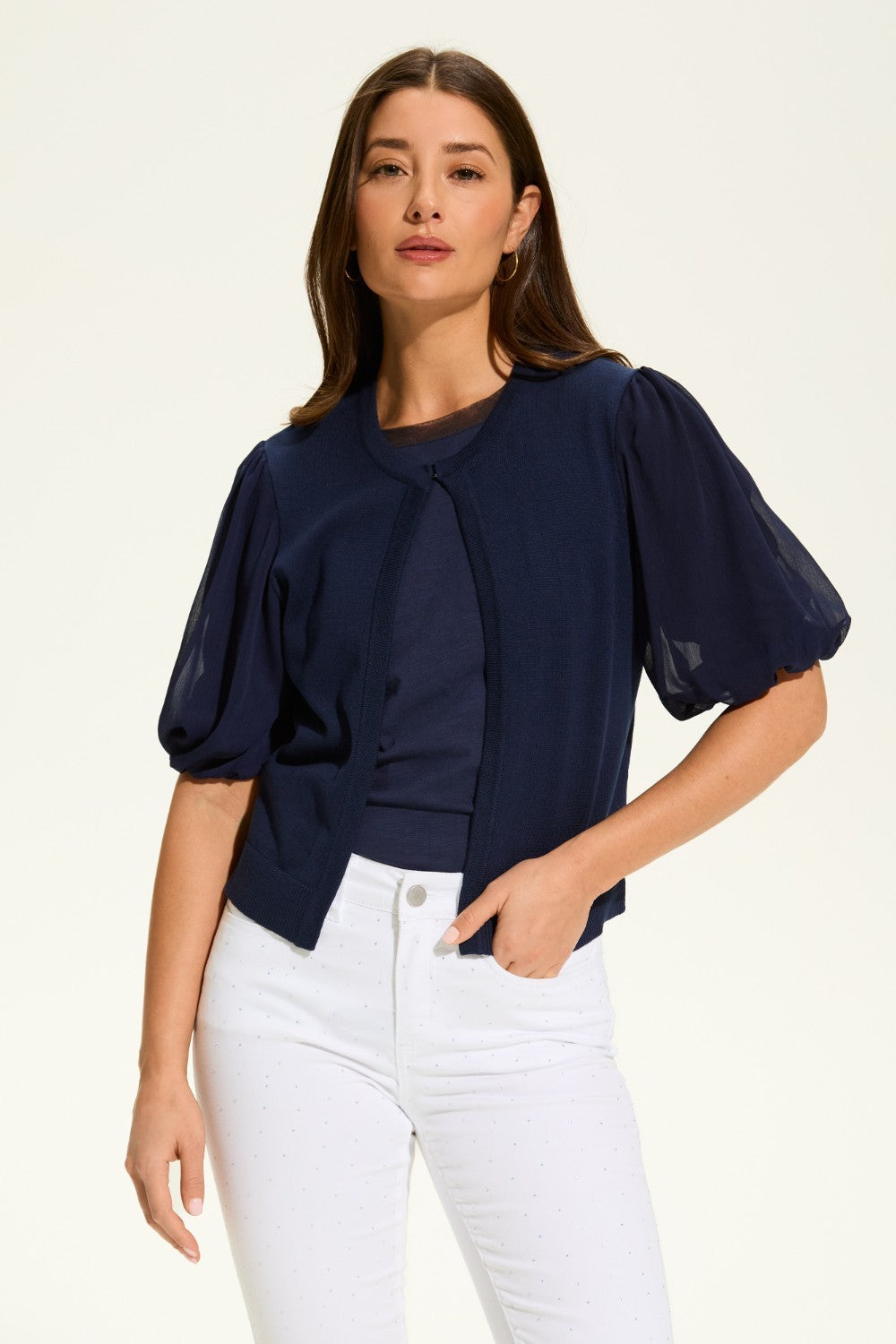 This versatile layering piece adds a touch of elegance to any outfit. The lightweight fabric provides a comfortable fit, while the sheer elbow length sleeves offer a stylish look. Perfect for dressing up or down, this cardigan is a must-have for any wardrobe.
