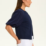 This versatile layering piece adds a touch of elegance to any outfit. The lightweight fabric provides a comfortable fit, while the sheer elbow length sleeves offer a stylish look. Perfect for dressing up or down, this cardigan is a must-have for any wardrobe.