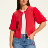 This versatile layering piece adds a touch of elegance to any outfit. The lightweight fabric provides a comfortable fit, while the sheer elbow length sleeves offer a stylish look. Perfect for dressing up or down, this cardigan is a must-have for any wardrobe.