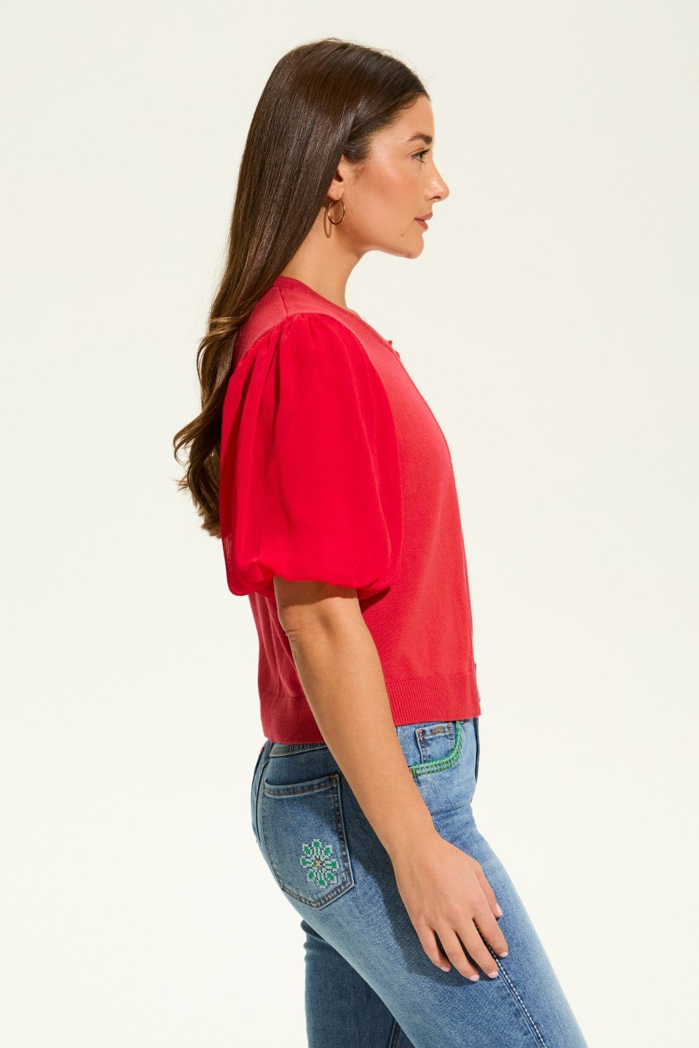 This versatile layering piece adds a touch of elegance to any outfit. The lightweight fabric provides a comfortable fit, while the sheer elbow length sleeves offer a stylish look. Perfect for dressing up or down, this cardigan is a must-have for any wardrobe.
