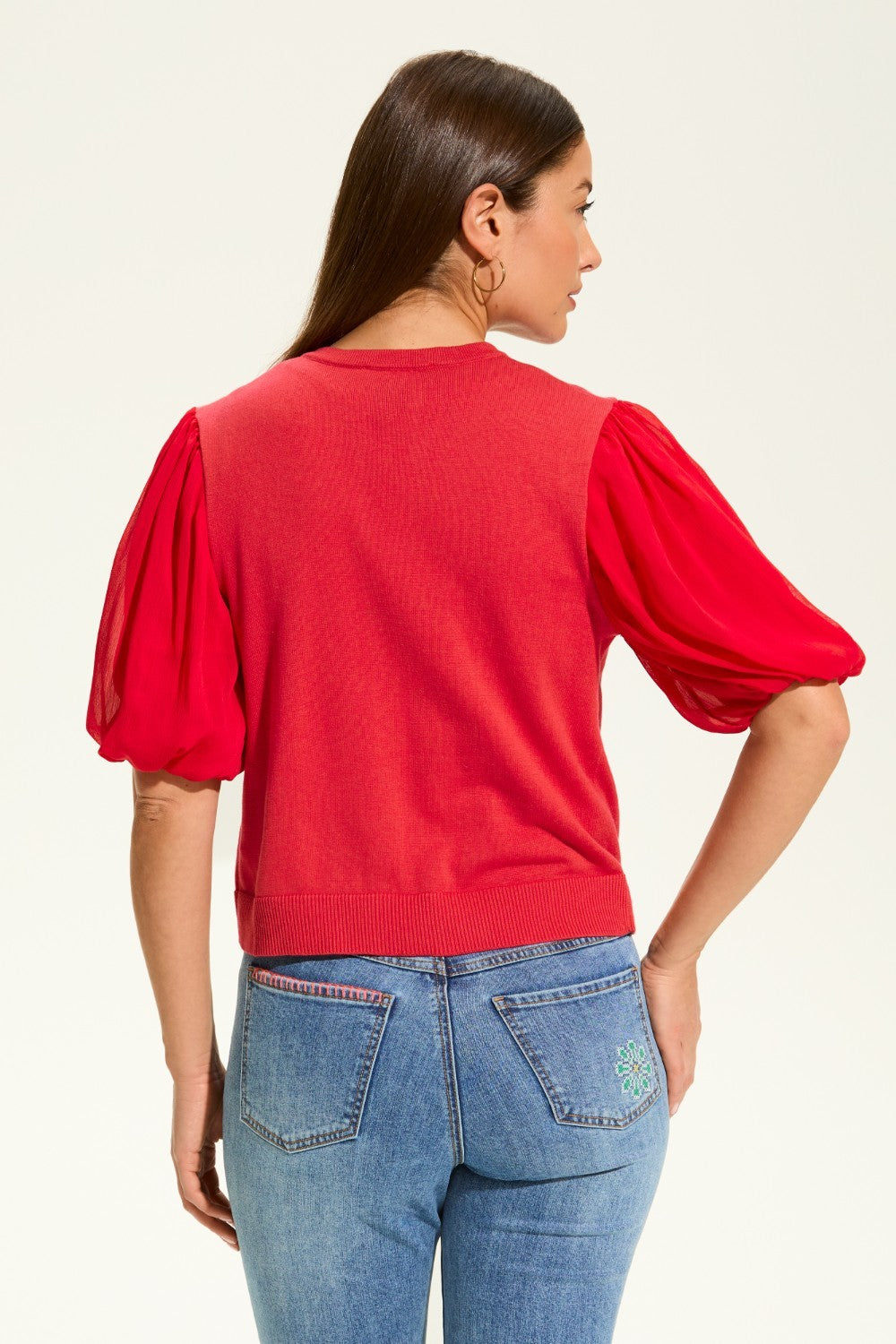 This versatile layering piece adds a touch of elegance to any outfit. The lightweight fabric provides a comfortable fit, while the sheer elbow length sleeves offer a stylish look. Perfect for dressing up or down, this cardigan is a must-have for any wardrobe.