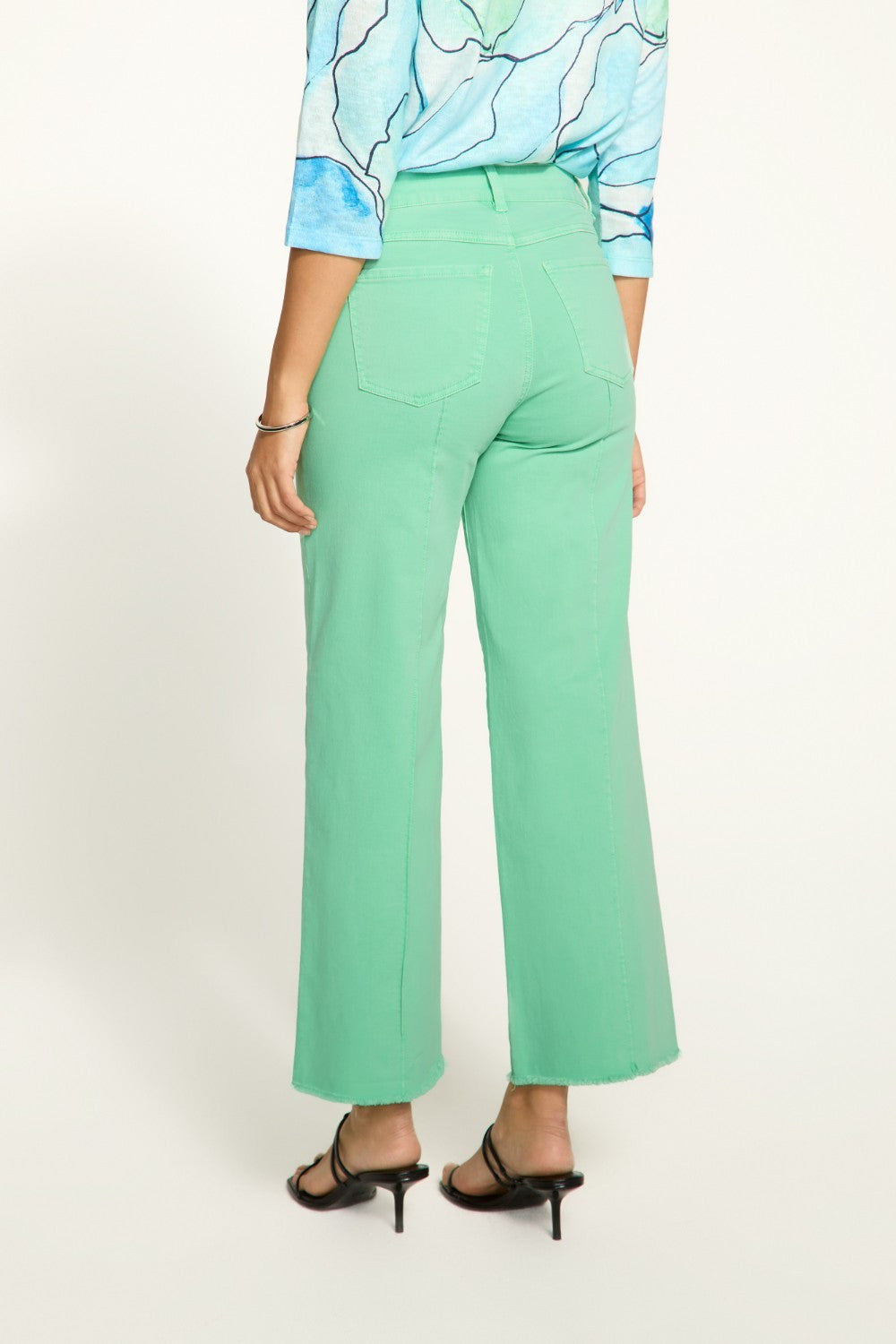 Introducing the FDJ Olivia Wide Ankle pants, designed to elevate your everyday style with its pintuck detailing and frayed bottom. These jeans are perfect for adding a touch of sophistication and edge to any outfit. Get ready to stand out from the crowd and make a statement with the FDJ Olivia Wide Ankle jeans!
