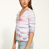 Get ready to wrap yourself up in the playful and soft FDJ Wrap Top! In vibrant colours, this top features rushe detailing at the 3/4 sleeves and a brilliant stitch at the top of the wrap to ensure it stays in place. Fun and comfortable, this top is sure to make a statement!