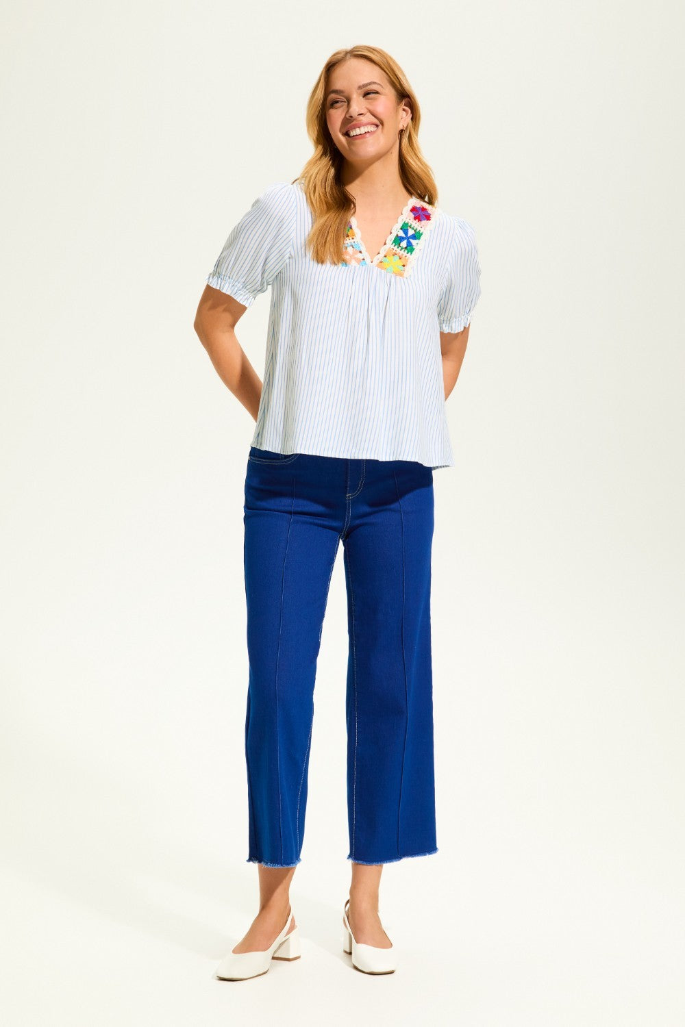 This FDJ V Neck Crochet Trim Blouse exudes boho chic style and pairs beautifully with denim. The intricate crochet trim adds a touch of femininity to this versatile blouse, making it a must-have for any fashion-forward wardrobe. Elevate your look with this stylish piece.