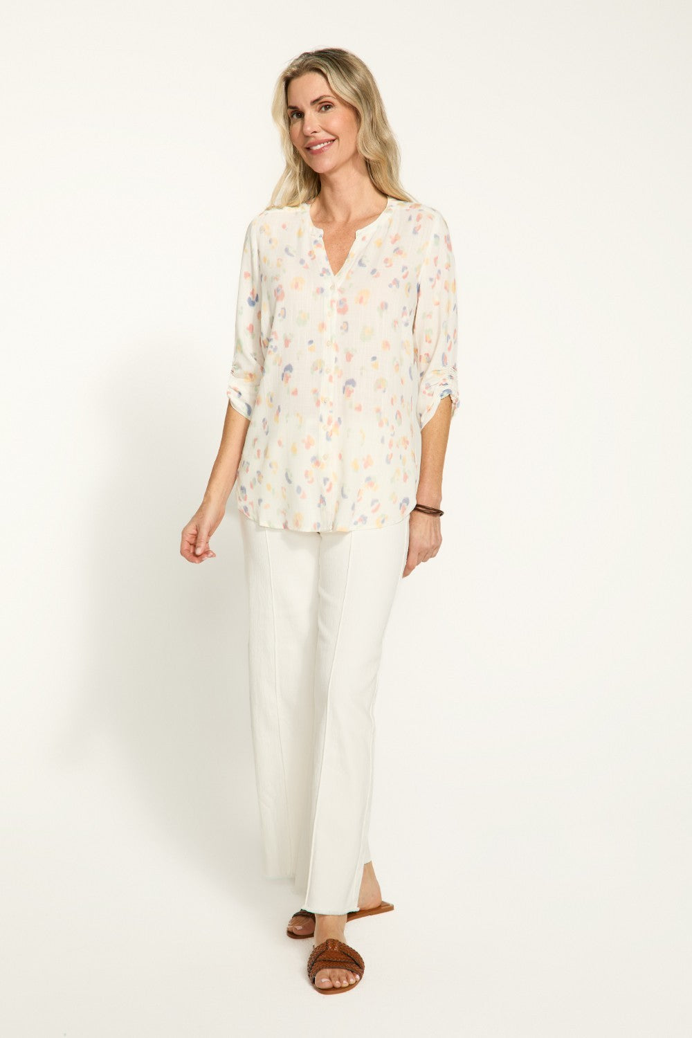 Elevate your wardrobe with our FDJ Smocked Sleeve Shirt. The subtle leopard print adds a touch of sophistication to any outfit, while the full button front allows for versatile styling options. Perfect for the fashion-forward individual looking to make a statement with their wardrobe.