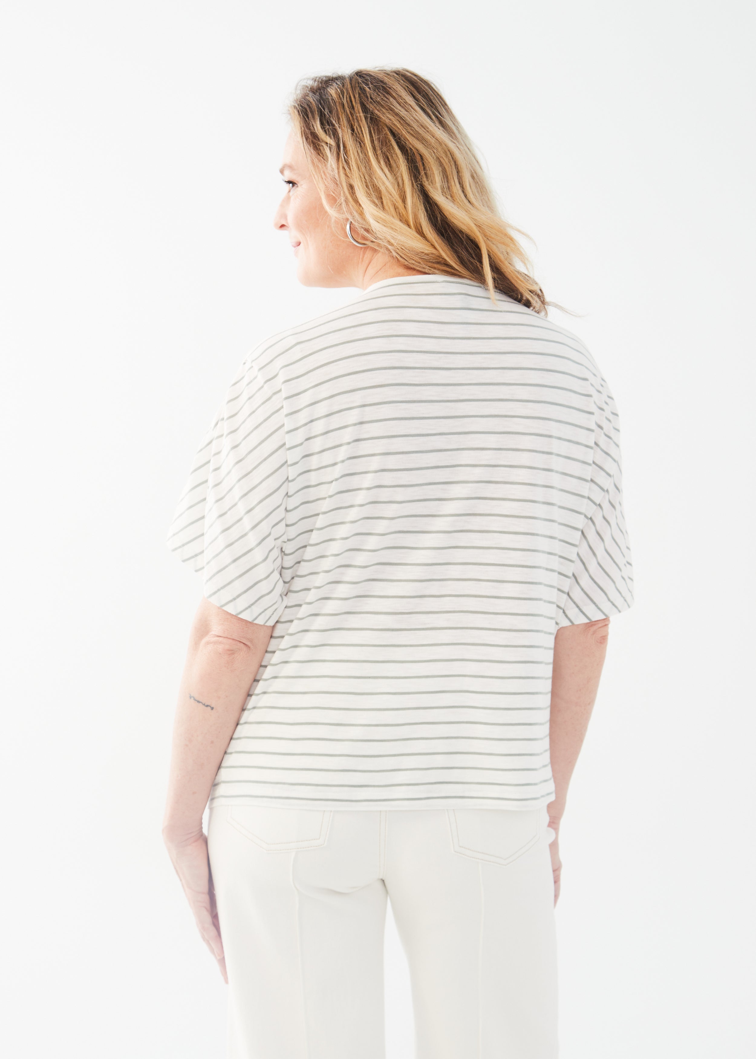 Get ready to set sail in style with the FDJ Boat Neck Elbow Sleeve Top! Made from a luxurious cotton modal blend, this top features a chic fern stripe that will have you looking effortlessly cool. This top is a must-have!