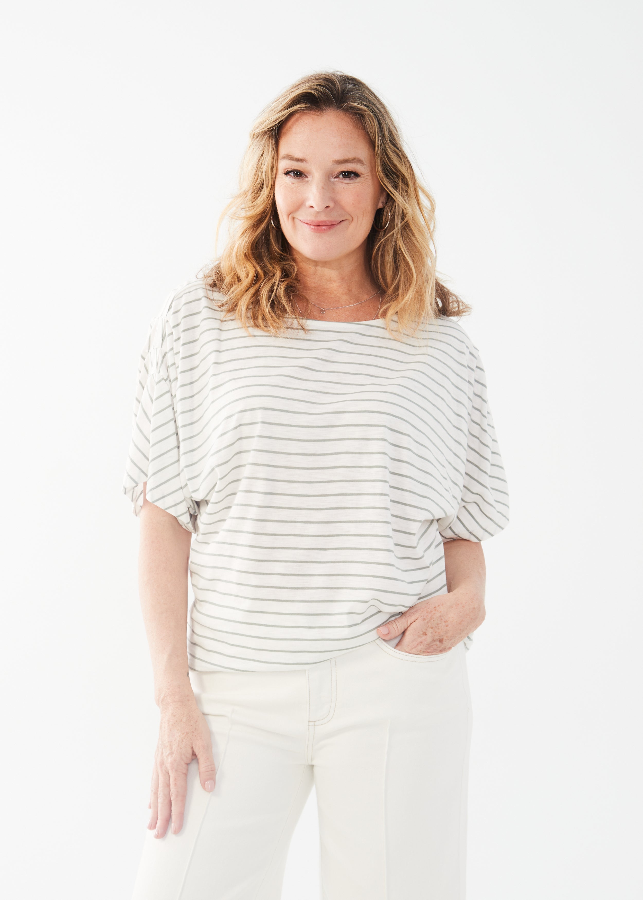 Get ready to set sail in style with the FDJ Boat Neck Elbow Sleeve Top! Made from a luxurious cotton modal blend, this top features a chic fern stripe that will have you looking effortlessly cool. This top is a must-have!