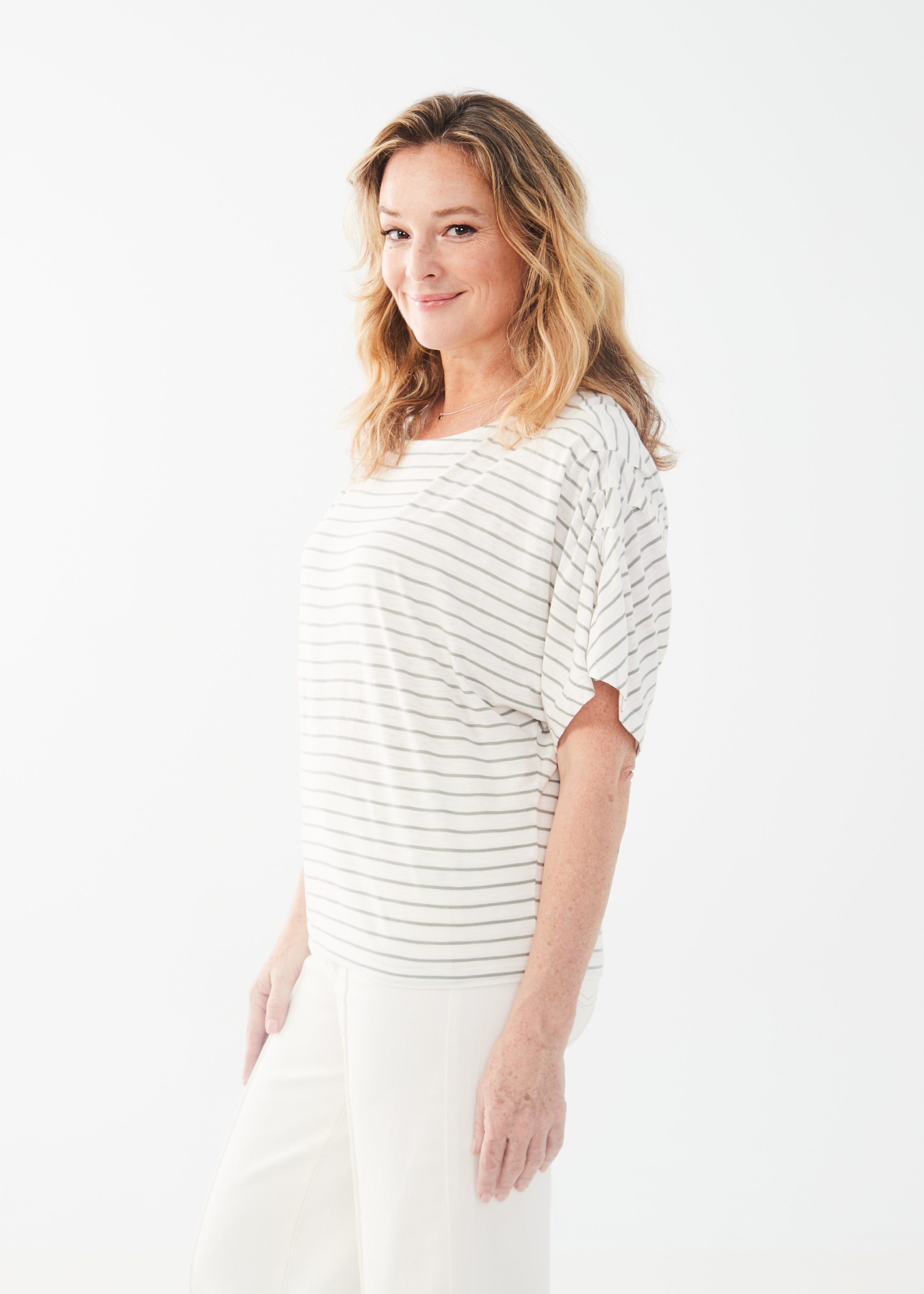 Get ready to set sail in style with the FDJ Boat Neck Elbow Sleeve Top! Made from a luxurious cotton modal blend, this top features a chic fern stripe that will have you looking effortlessly cool. This top is a must-have!