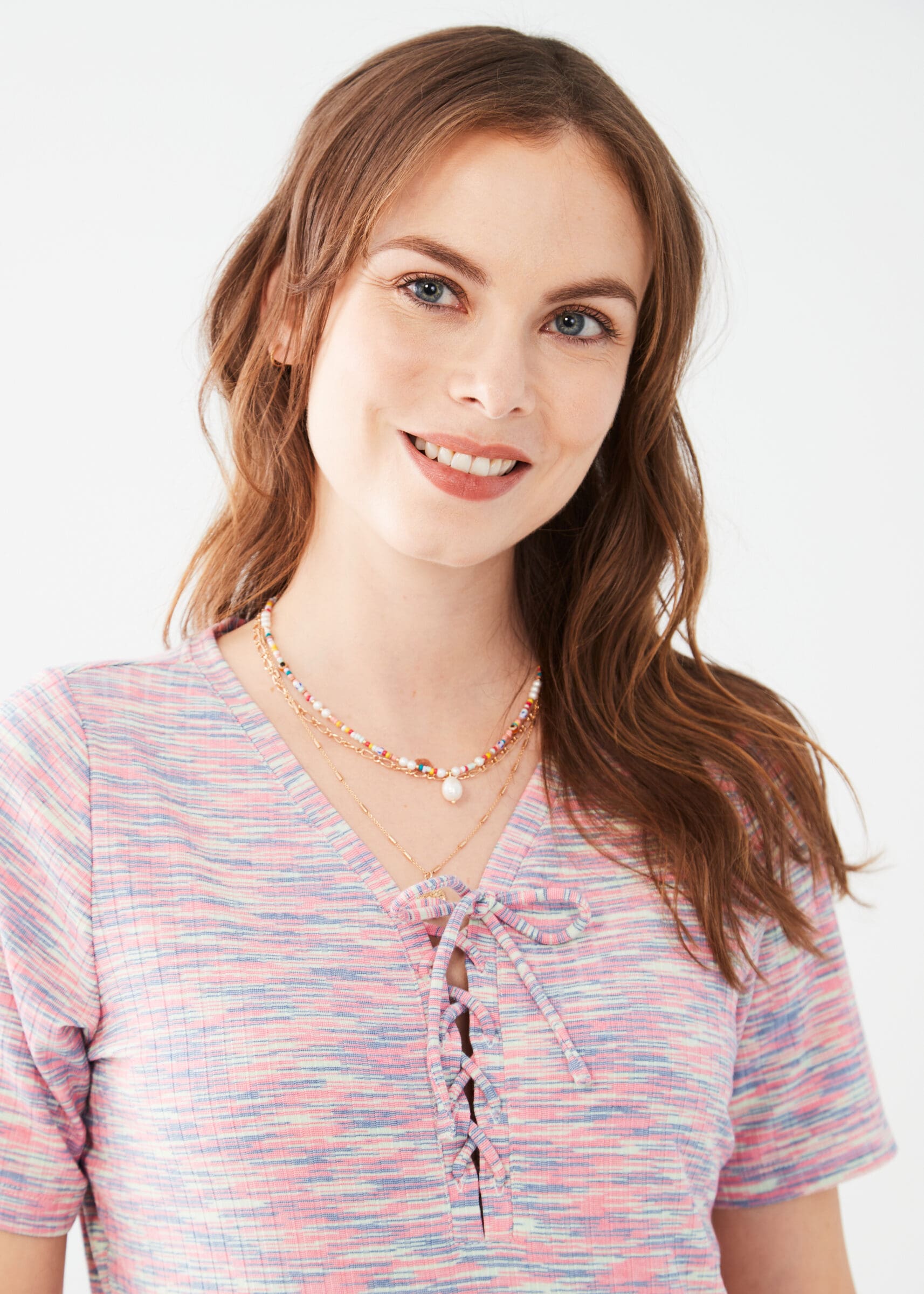 Looking for a standout knit top? We've got you covered with our FDJ Elbow Sleeve Lace Up Knit Top. Featuring a playful lace up front and elbow length sleeves, this top adds a touch of fun to any outfit. Get ready to turn heads with this unique and stylish piece.