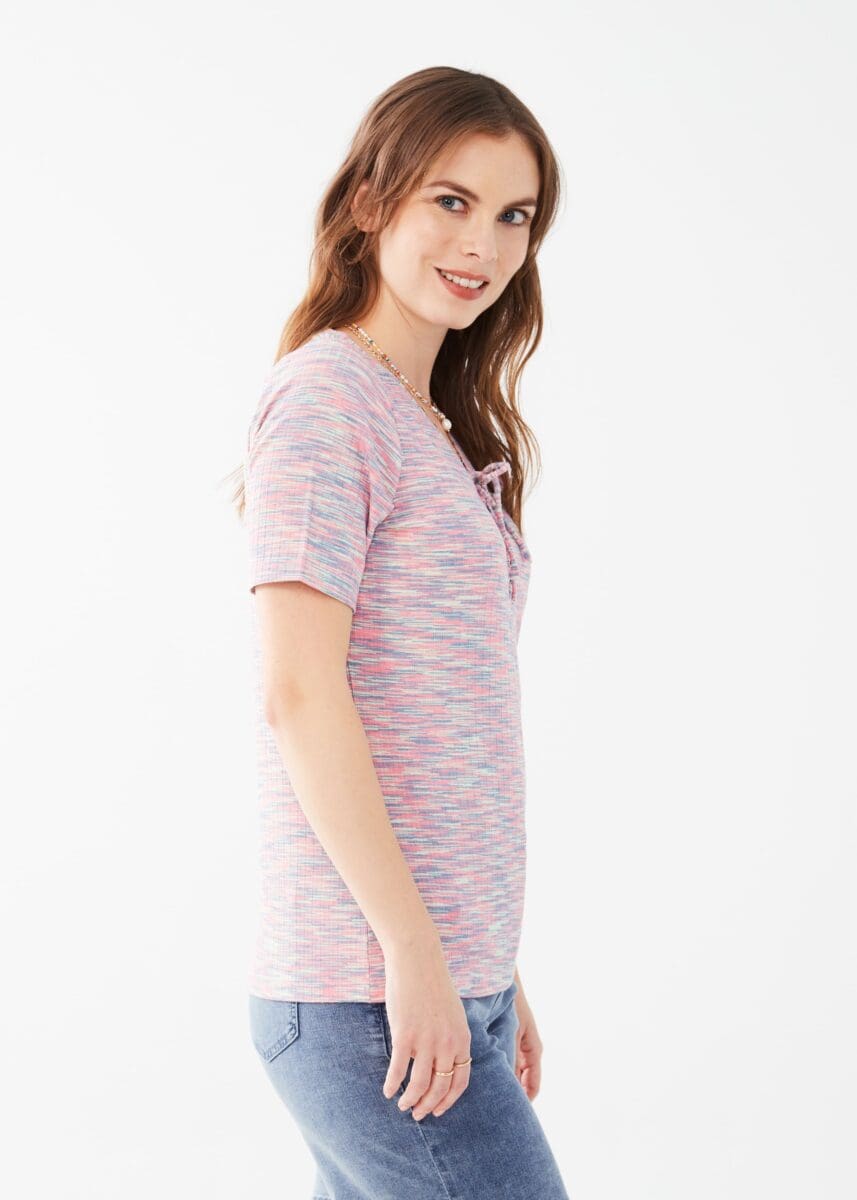 Looking for a standout knit top? We've got you covered with our FDJ Elbow Sleeve Lace Up Knit Top. Featuring a playful lace up front and elbow length sleeves, this top adds a touch of fun to any outfit. Get ready to turn heads with this unique and stylish piece.