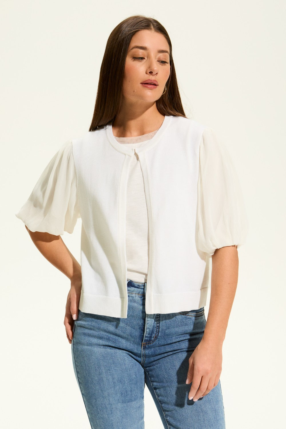 This versatile layering piece adds a touch of elegance to any outfit. The lightweight fabric provides a comfortable fit, while the sheer elbow length sleeves offer a stylish look. Perfect for dressing up or down, this cardigan is a must-have for any wardrobe.