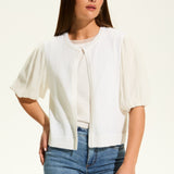 This versatile layering piece adds a touch of elegance to any outfit. The lightweight fabric provides a comfortable fit, while the sheer elbow length sleeves offer a stylish look. Perfect for dressing up or down, this cardigan is a must-have for any wardrobe.
