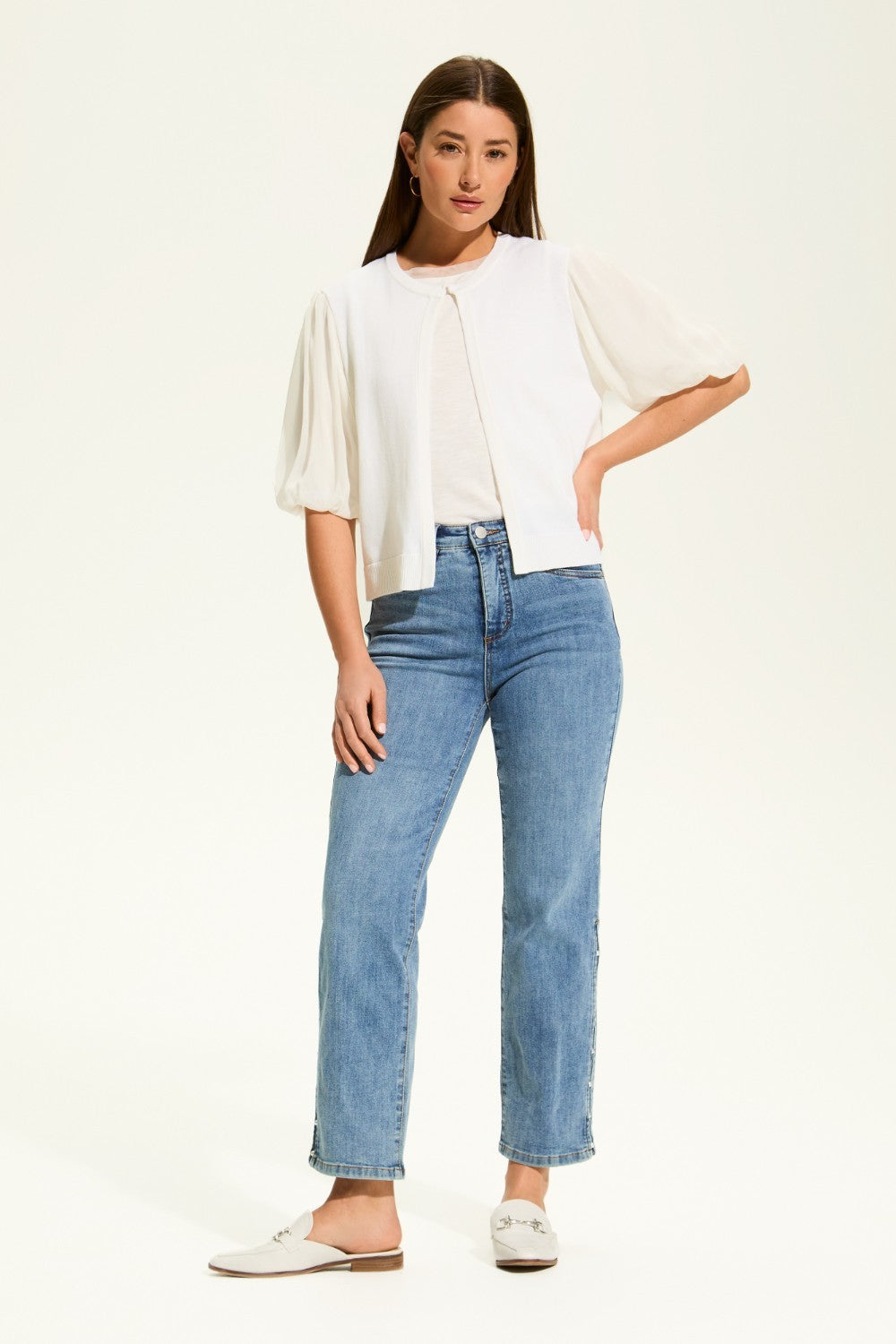 This versatile layering piece adds a touch of elegance to any outfit. The lightweight fabric provides a comfortable fit, while the sheer elbow length sleeves offer a stylish look. Perfect for dressing up or down, this cardigan is a must-have for any wardrobe.