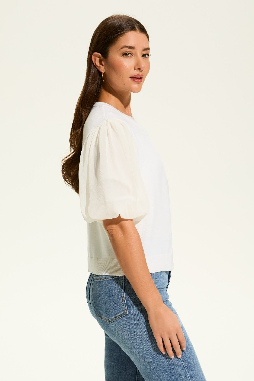 This versatile layering piece adds a touch of elegance to any outfit. The lightweight fabric provides a comfortable fit, while the sheer elbow length sleeves offer a stylish look. Perfect for dressing up or down, this cardigan is a must-have for any wardrobe.