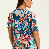 The FDJ Elbow Sleeve Embellished Top is the perfect addition to your wardrobe. With a beautiful floral design and striking detail at the neck line, this top offers a pop of colour to any outfit. Its loose and comfortable fit makes it perfect for casual wear, and it pairs perfectly with denim for a stylish and effortless look.