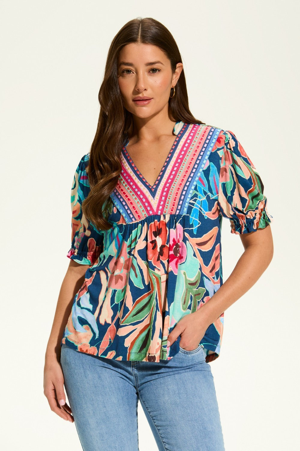 The FDJ Elbow Sleeve Embellished Top is the perfect addition to your wardrobe. With a beautiful floral design and striking detail at the neck line, this top offers a pop of colour to any outfit. Its loose and comfortable fit makes it perfect for casual wear, and it pairs perfectly with denim for a stylish and effortless look.