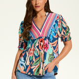 The FDJ Elbow Sleeve Embellished Top is the perfect addition to your wardrobe. With a beautiful floral design and striking detail at the neck line, this top offers a pop of colour to any outfit. Its loose and comfortable fit makes it perfect for casual wear, and it pairs perfectly with denim for a stylish and effortless look.