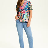 The FDJ Elbow Sleeve Embellished Top is the perfect addition to your wardrobe. With a beautiful floral design and striking detail at the neck line, this top offers a pop of colour to any outfit. Its loose and comfortable fit makes it perfect for casual wear, and it pairs perfectly with denim for a stylish and effortless look.