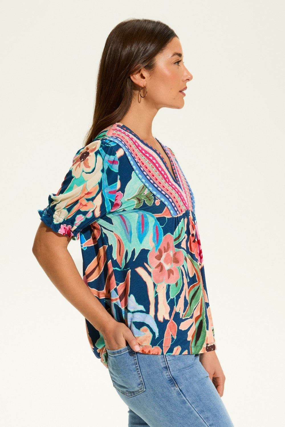The FDJ Elbow Sleeve Embellished Top is the perfect addition to your wardrobe. With a beautiful floral design and striking detail at the neck line, this top offers a pop of colour to any outfit. Its loose and comfortable fit makes it perfect for casual wear, and it pairs perfectly with denim for a stylish and effortless look.