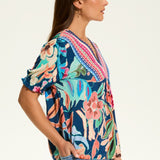 The FDJ Elbow Sleeve Embellished Top is the perfect addition to your wardrobe. With a beautiful floral design and striking detail at the neck line, this top offers a pop of colour to any outfit. Its loose and comfortable fit makes it perfect for casual wear, and it pairs perfectly with denim for a stylish and effortless look.