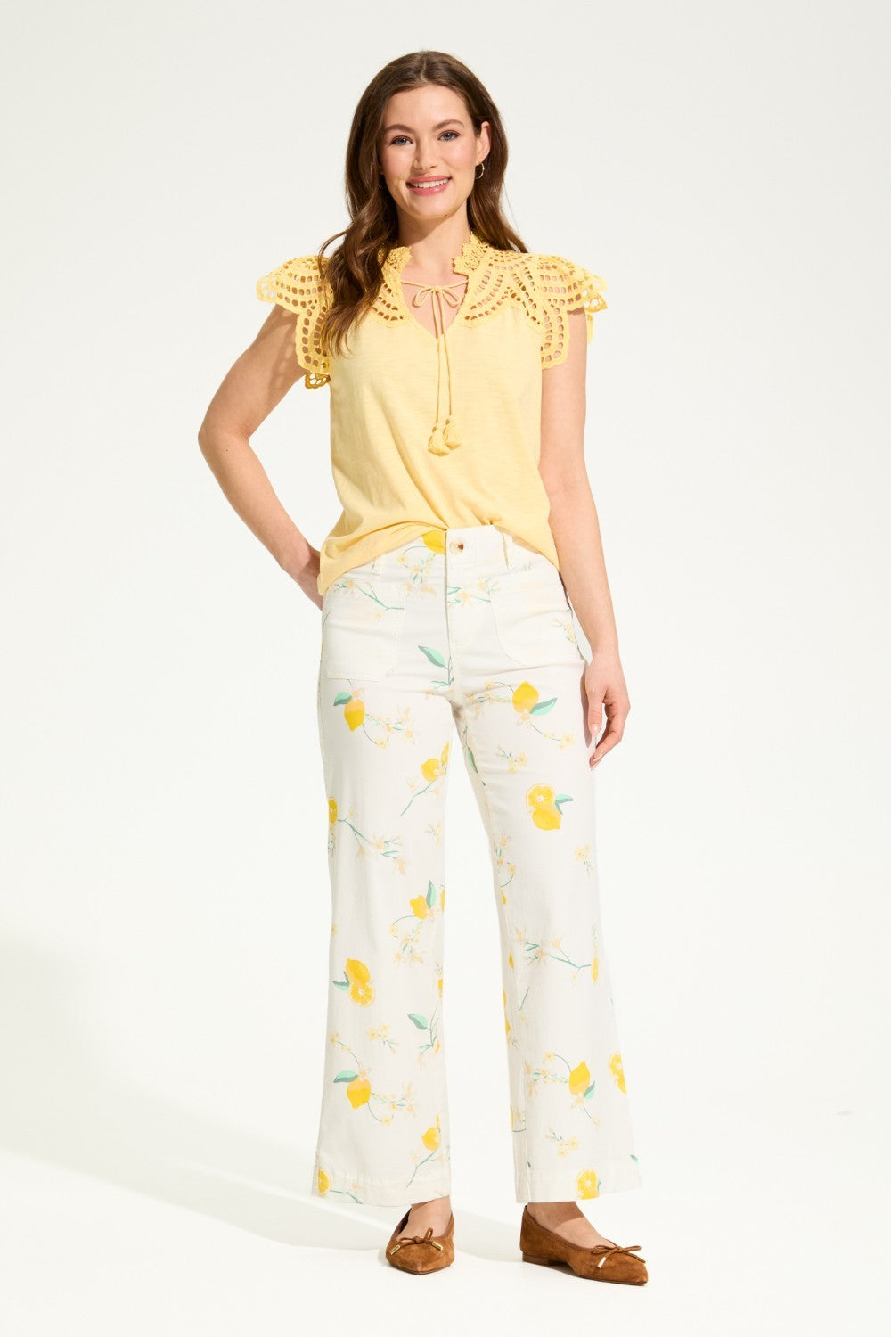 Brighten up your wardrobe with the FDJ Flutter Sleeve Placed Eyelet Top! This solid yellow top is sure to add a pop of colour to any outfit, making you look and feel cheery all day long. Don't miss out on this pretty piece.