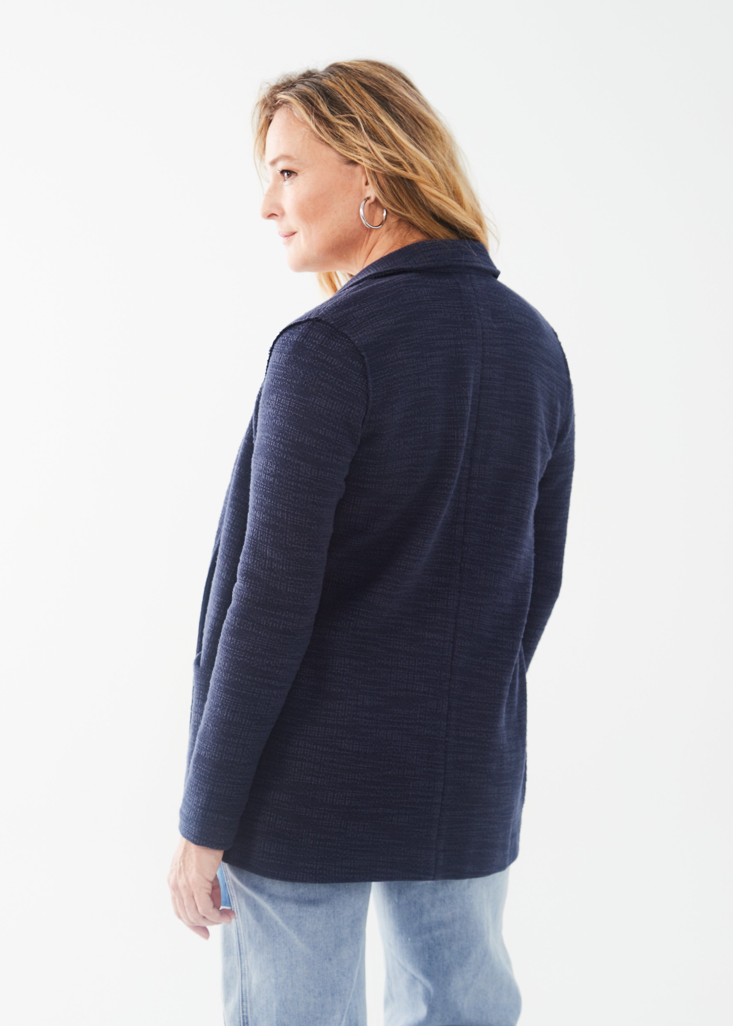 Crafted with a soft structure, the FDJ Knit Blazer in navy offers a tailored yet comfortable fit. Featuring a one button closure and deep, functional front pockets, this blazer is perfect for all-day wear. Elevate your style and confidence with this versatile and stylish blazer.