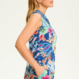 Flaunt your vibrant style with the FDJ Printed Eyelet Sleeveless Top. Made of 100% cotton, this top is both comfortable and chic. Its bright and cheery floral design adds a touch of playfulness to any outfit. Perfect for those who don't take themselves too seriously.