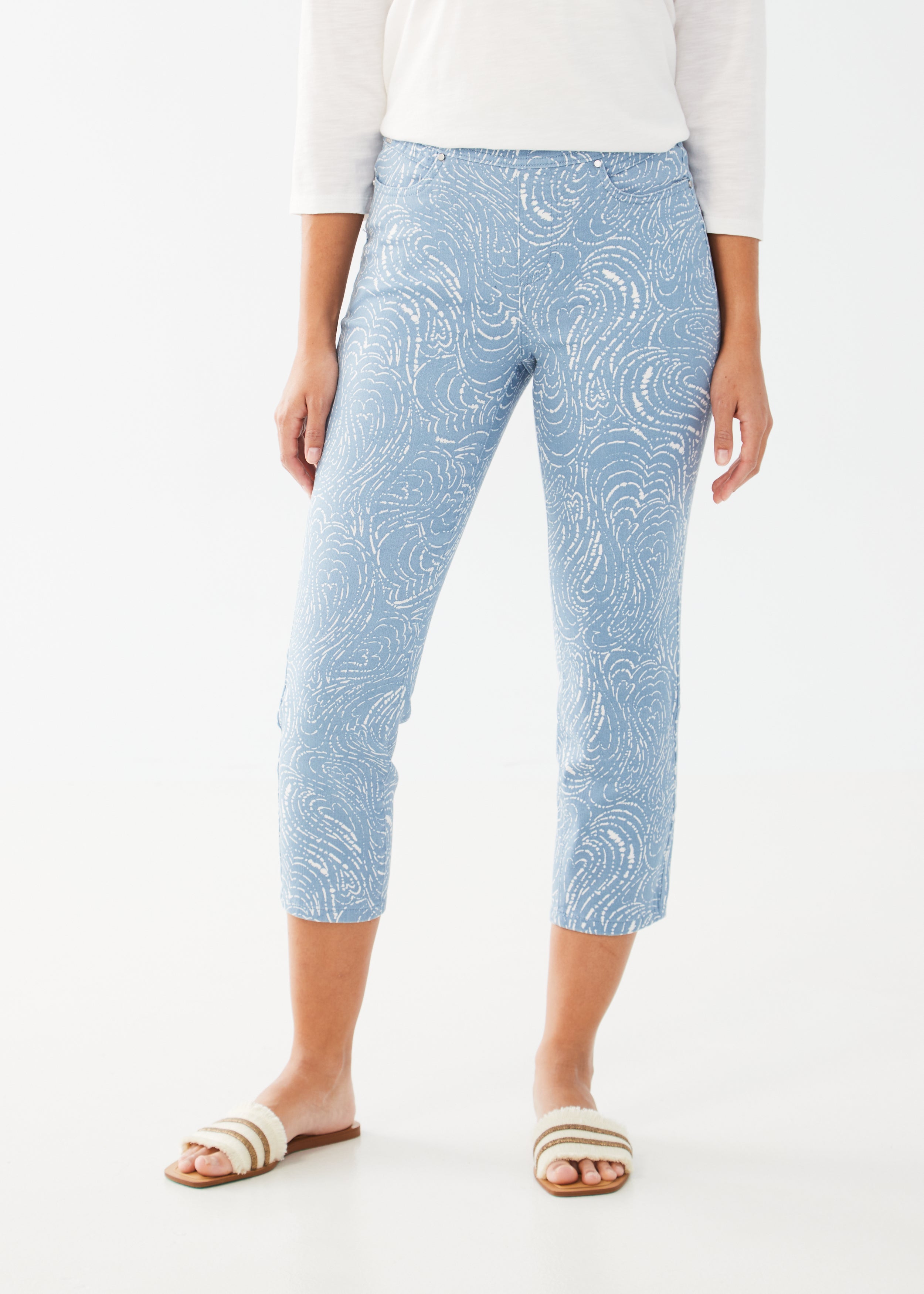 Get ready to make a statement with the FDJ Pull-On Slim Crop Pant! Featuring a striking Trapped Hearts print, these pants are sure to turn heads. Designed with a slim fit and pull-on style, they offer both comfort and style. Elevate your wardrobe with this must-have piece.