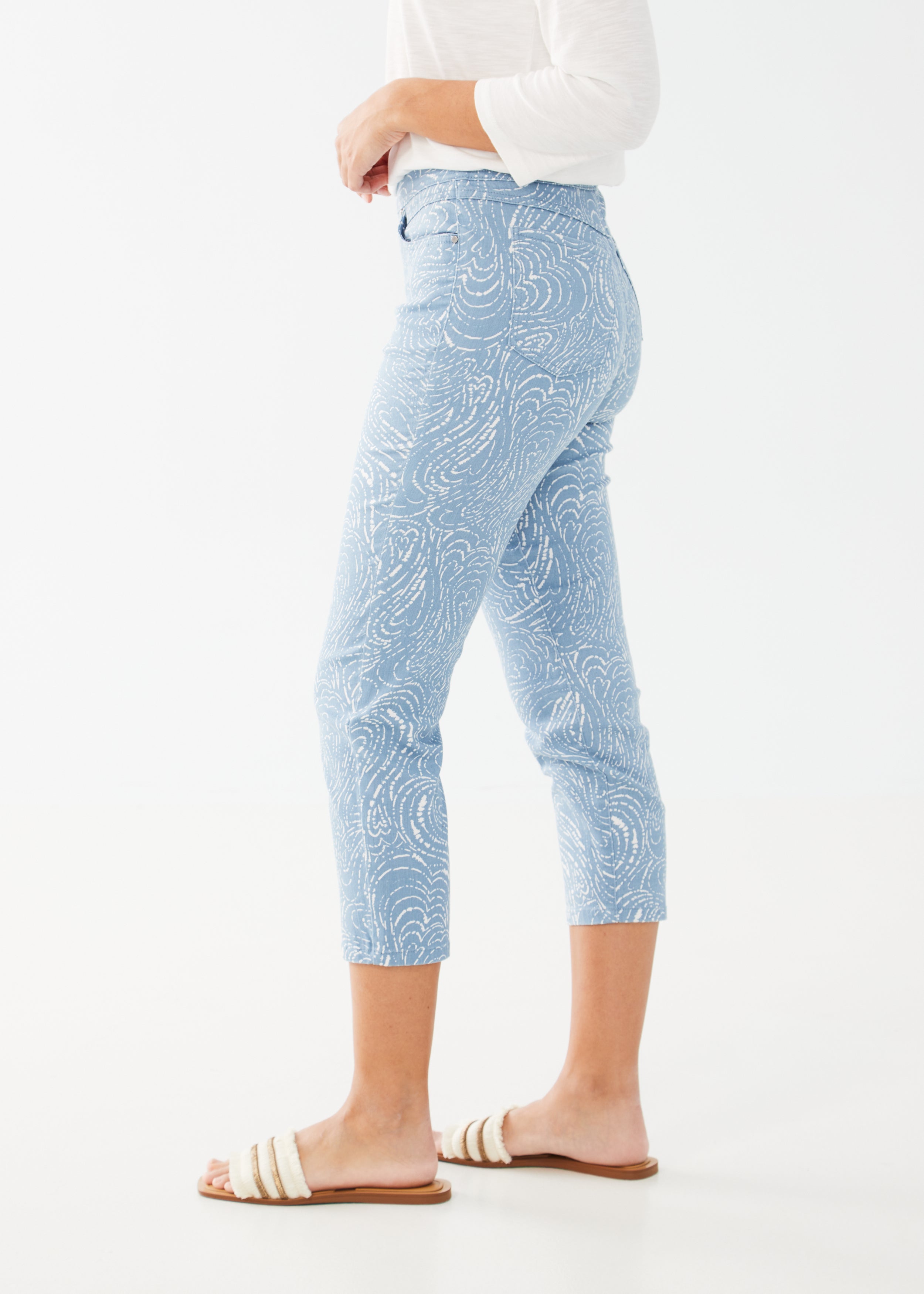 Get ready to make a statement with the FDJ Pull-On Slim Crop Pant! Featuring a striking Trapped Hearts print, these pants are sure to turn heads. Designed with a slim fit and pull-on style, they offer both comfort and style. Elevate your wardrobe with this must-have piece.