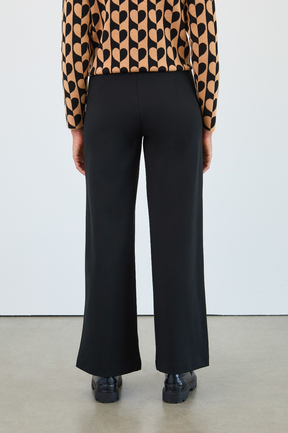 Crafted from premium Ponte de Roma fabric, these pants offer luxurious softness and excellent stretch for effortless all-day comfort.