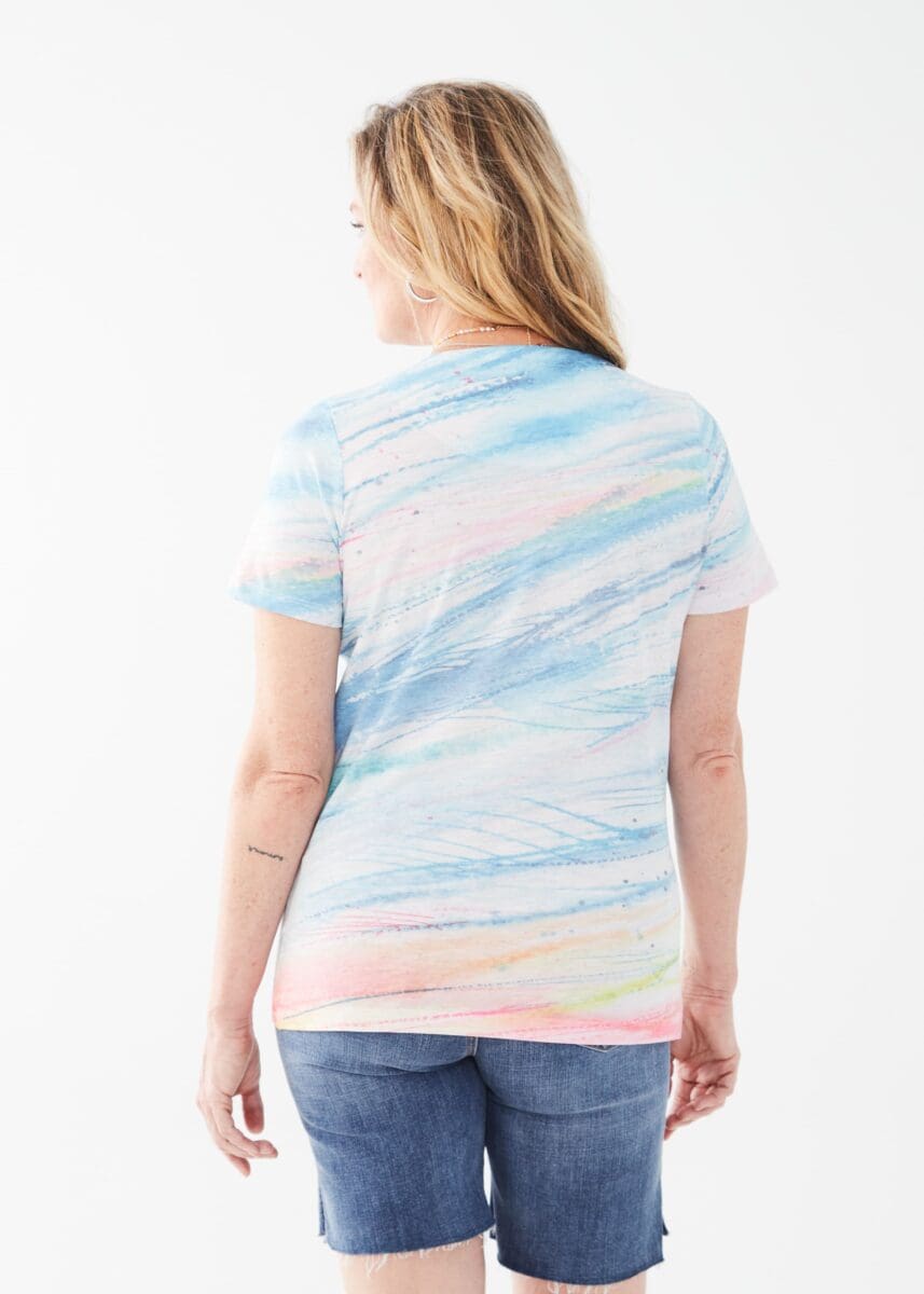Get ready to add some fun to your wardrobe with the FDJ Short Sleeve Scoop Neck Top! Featuring a scoop neck design and a vibrant multicolour pattern, this top is sure to bring a smile to your face and spice up any outfit.
