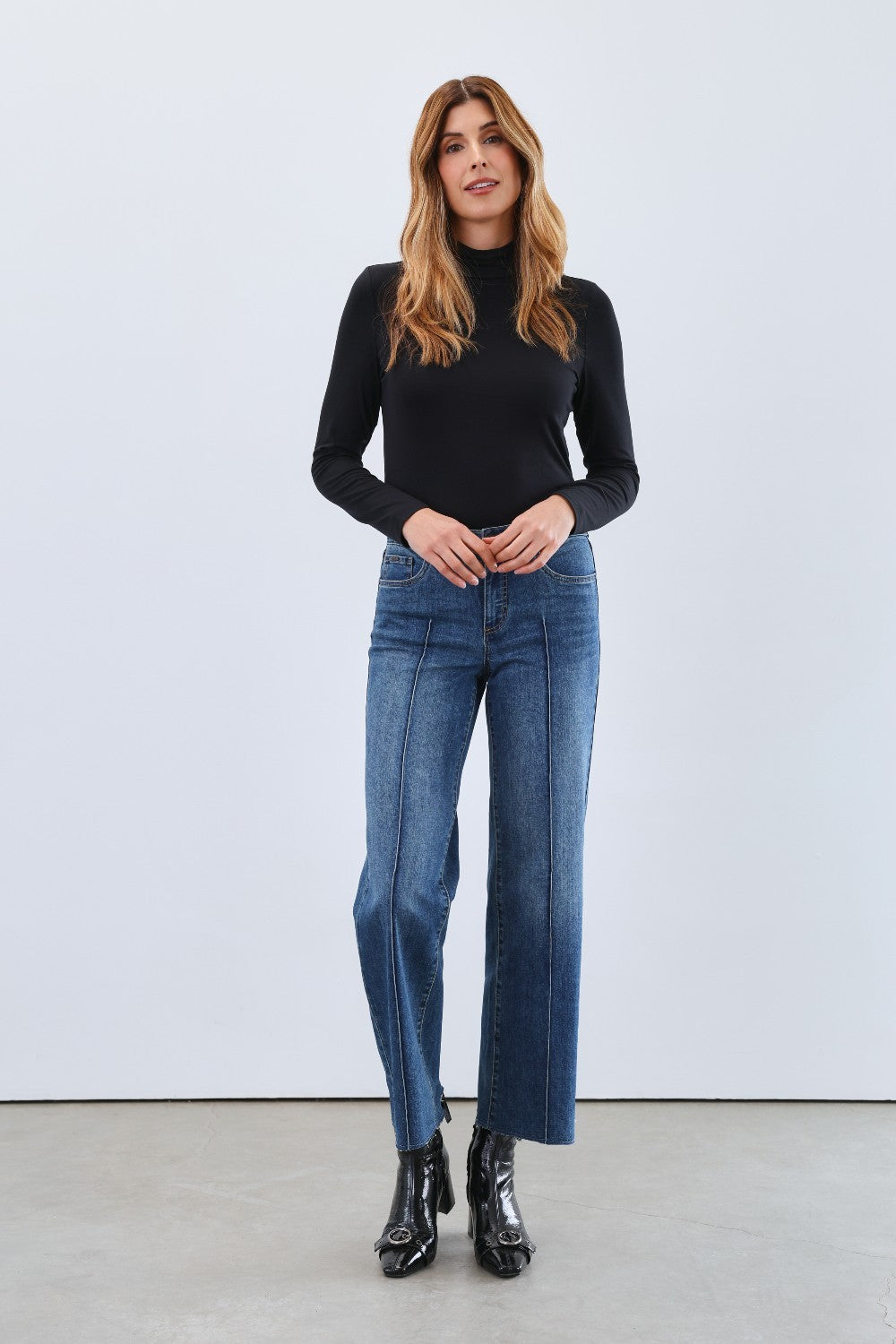 The FDJ Long Sleeve Mock Neck Top is a classic, basic layering piece designed to complement any wardrobe. Its simple yet elegant style makes it perfect for layering under jackets or wearing alone for a clean, polished look. Comfortable and versatile, it’s an essential addition to your everyday collection.