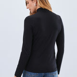 The FDJ Long Sleeve Mock Neck Top is a classic, basic layering piece designed to complement any wardrobe. Its simple yet elegant style makes it perfect for layering under jackets or wearing alone for a clean, polished look. Comfortable and versatile, it’s an essential addition to your everyday collection.