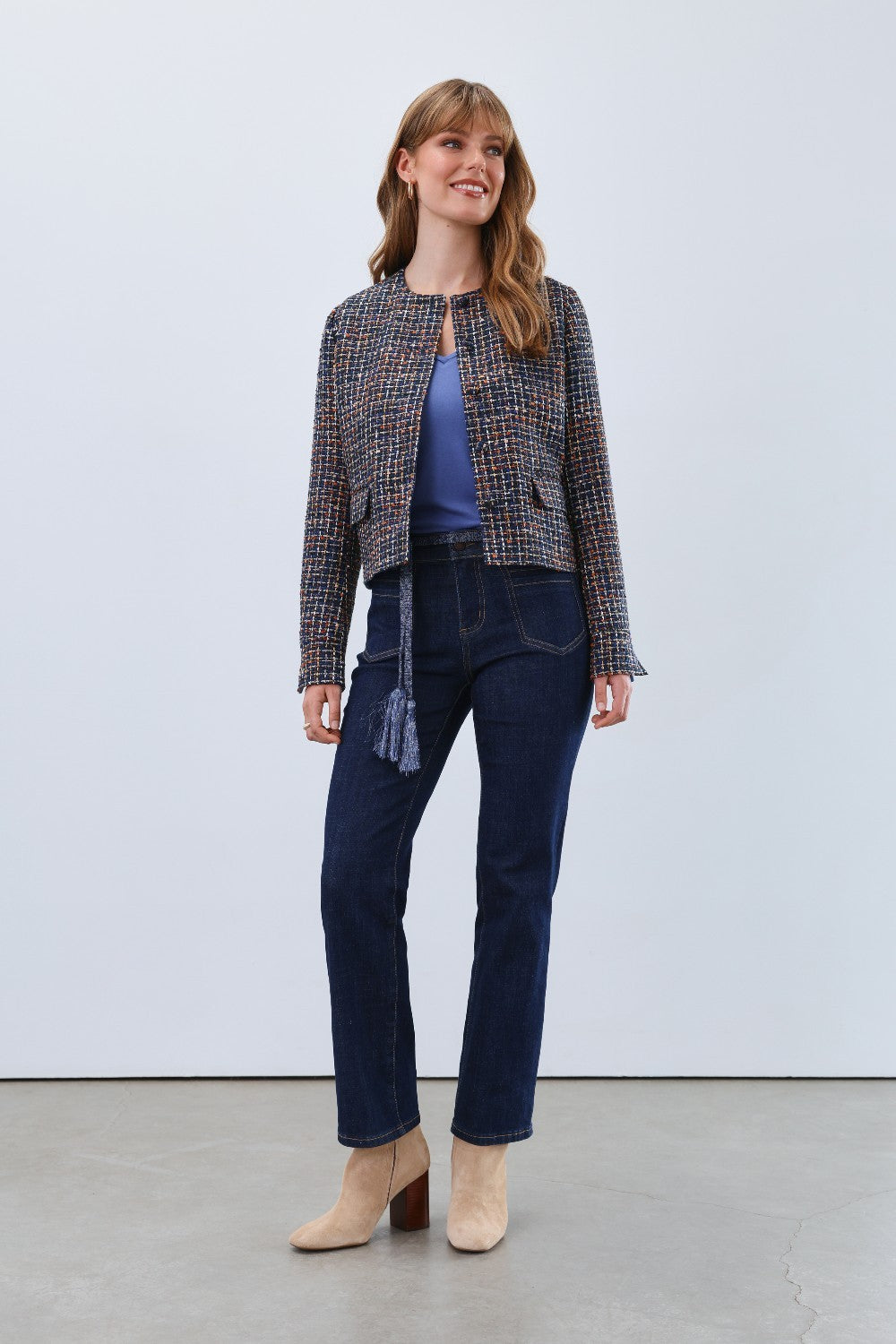 Elevate your wardrobe with the FDJ Tweed Collarless Jacket, a timeless piece that blends classic texture with modern sophistication. Its refined tweed fabric offers warmth and durability, while the collarless design creates a sleek, versatile silhouette perfect for both professional and casual settings. Experience effortless style and comfort that transitions seamlessly from day to night.