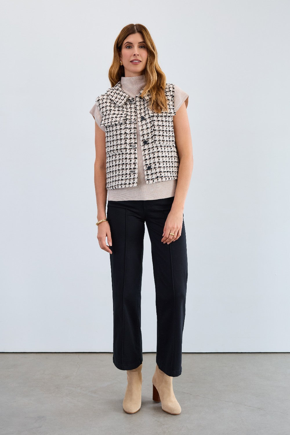The FDJ Tweed Vest combines timeless style with modern design, featuring a full button front for easy wear and a polished look. Its classic tweed fabric offers a refined texture, making it a versatile addition to your wardrobe. Perfect for layering, this vest supports your style with comfort and sophistication.