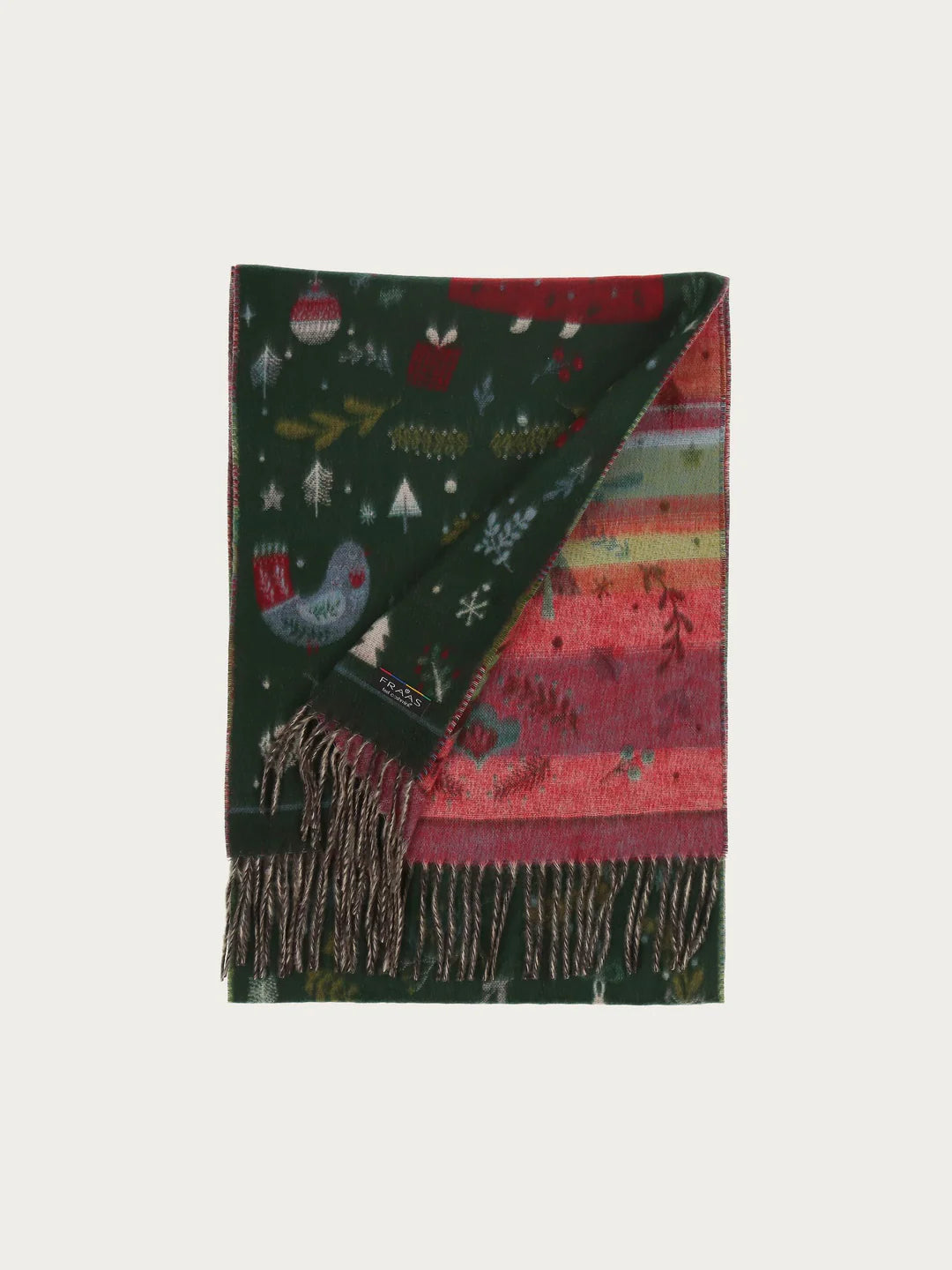 Christmas can come! The scarf with cheerful Christmas motifs from FRAAS spreads good cheer and creates a Christmas atmosphere. The woven scarf is 35 x 200 cm in size and made of extra soft cashmink, the specialty from FRAAS. Keeps out the cold and moisture and is also suitable for allergy sufferers. The scarf MADE IN GERMANY is the ideal companion for everyone who loves Christmas.