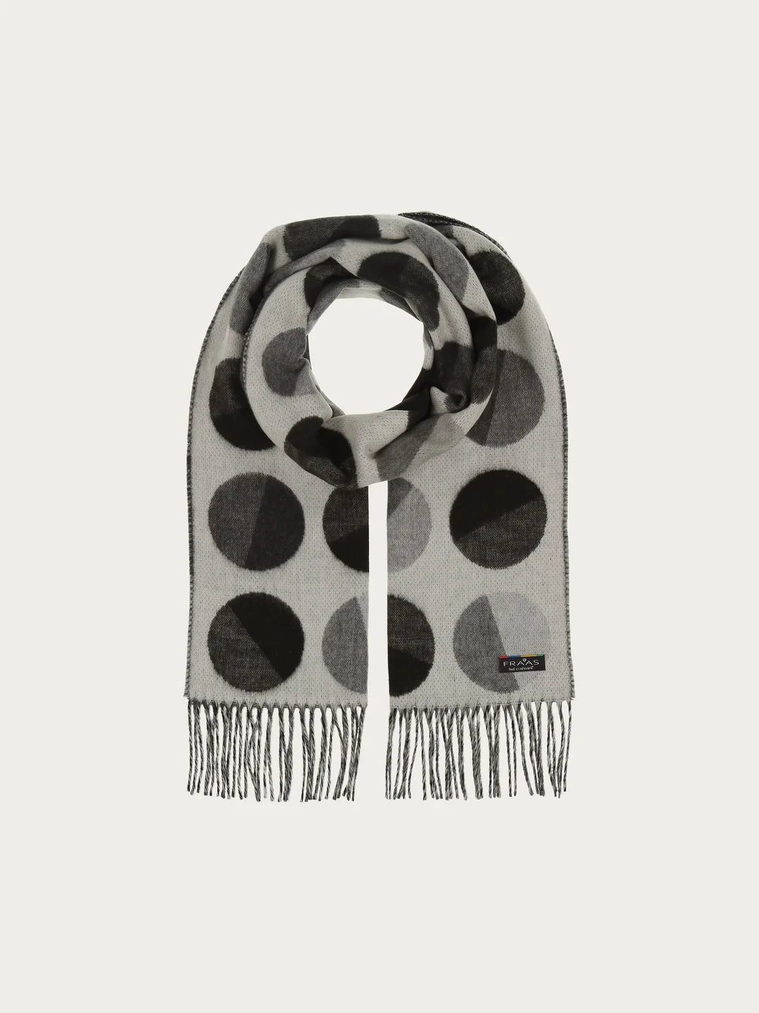 XXL dots all over! We love the cheerful scarf with extra large dots made of pure cashmink - MADE IN GERMANY. It is comfortable to wear: warm, cuddly soft and gentle on the skin. The scarf can be perfectly and easily combined with different styles. Bring your outfit to the point.