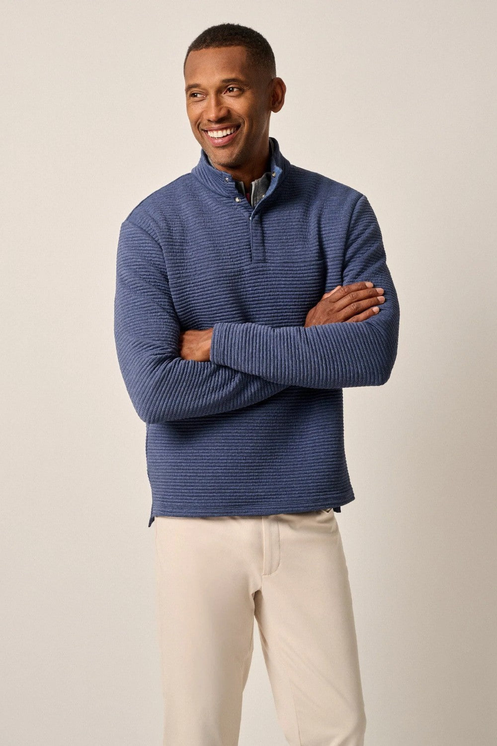 This tech-forward, snap quarter-zip is made with a textured blend of recycled material that looks cool, feels cool and performs like a champ