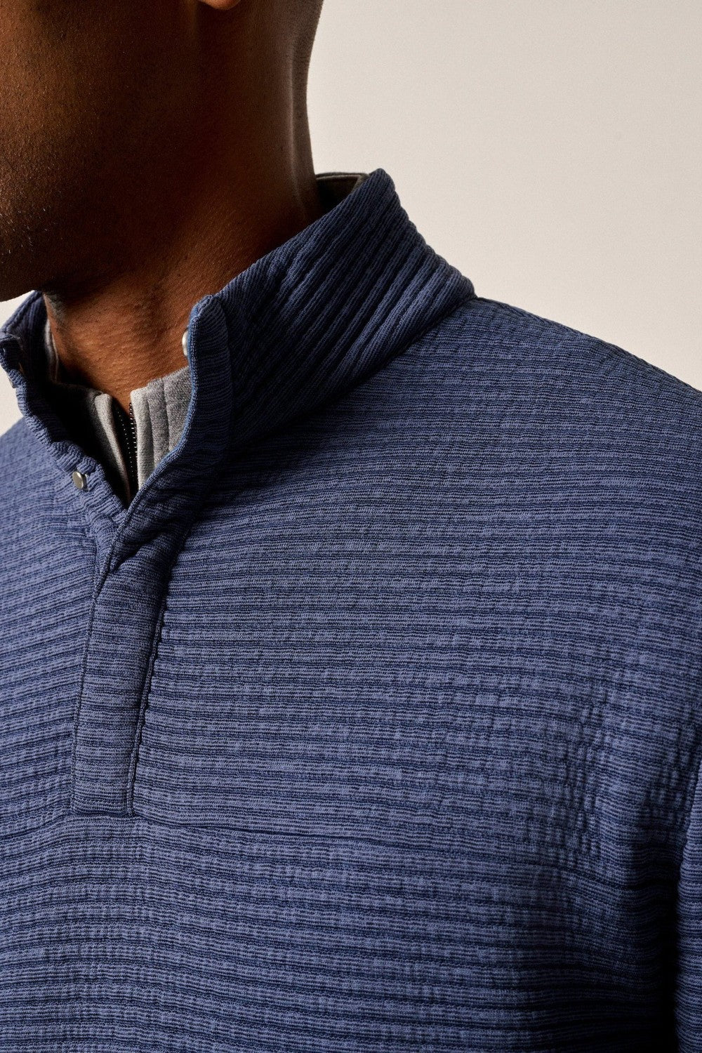 This tech-forward, snap quarter-zip is made with a textured blend of recycled material that looks cool, feels cool and performs like a champ