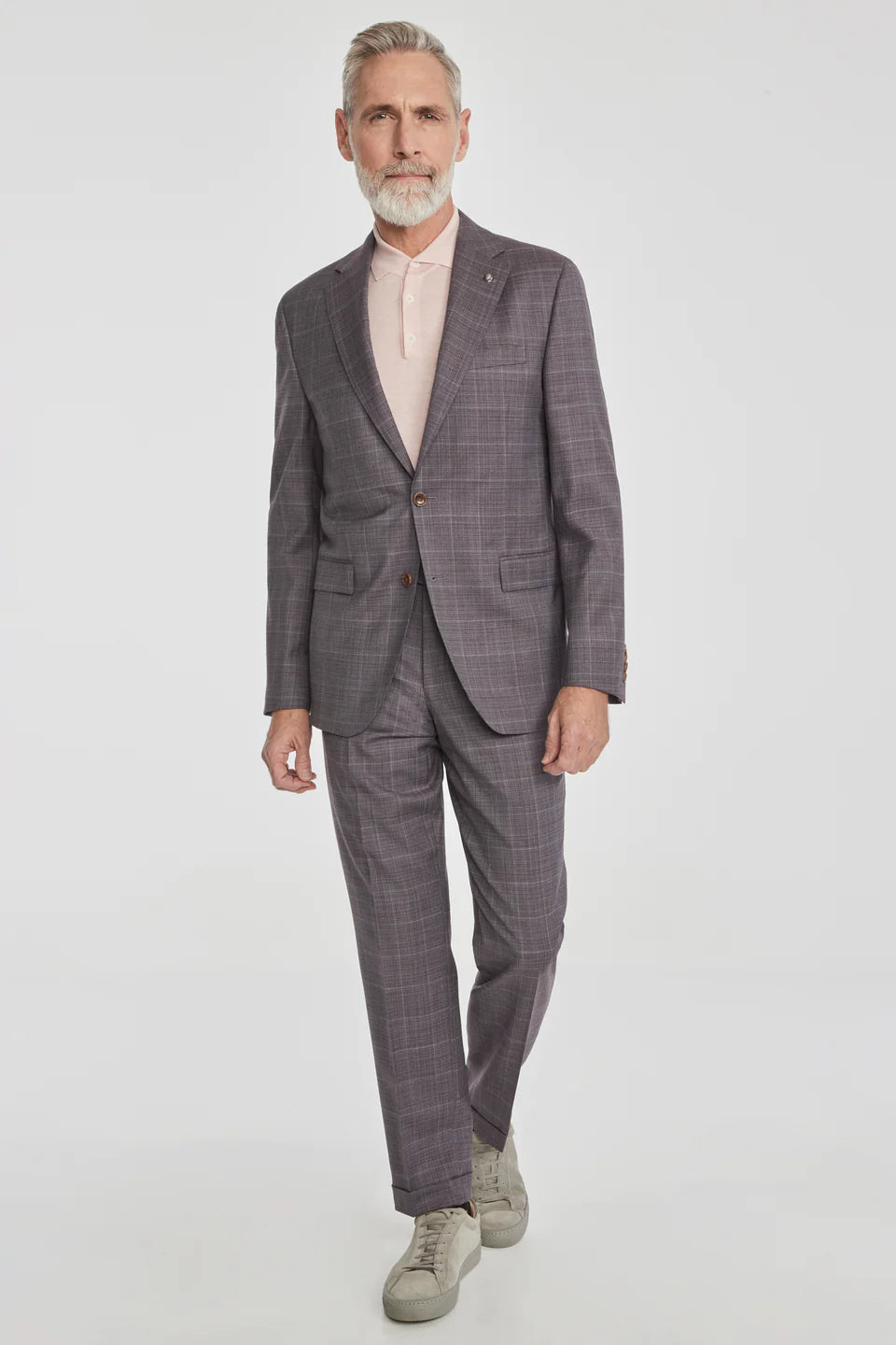 This Esprit suit featuring a soft plum tonal windowpane crafted from super 120's wool woven in Italy. The perfect year round weight meets stretch comfort.