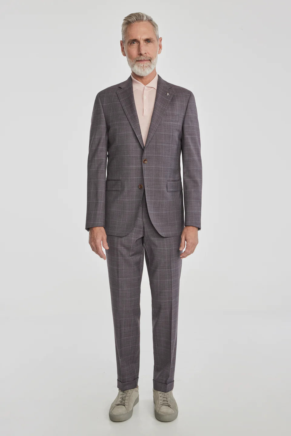 This Esprit suit featuring a soft plum tonal windowpane crafted from super 120's wool woven in Italy. The perfect year round weight meets stretch comfort.
