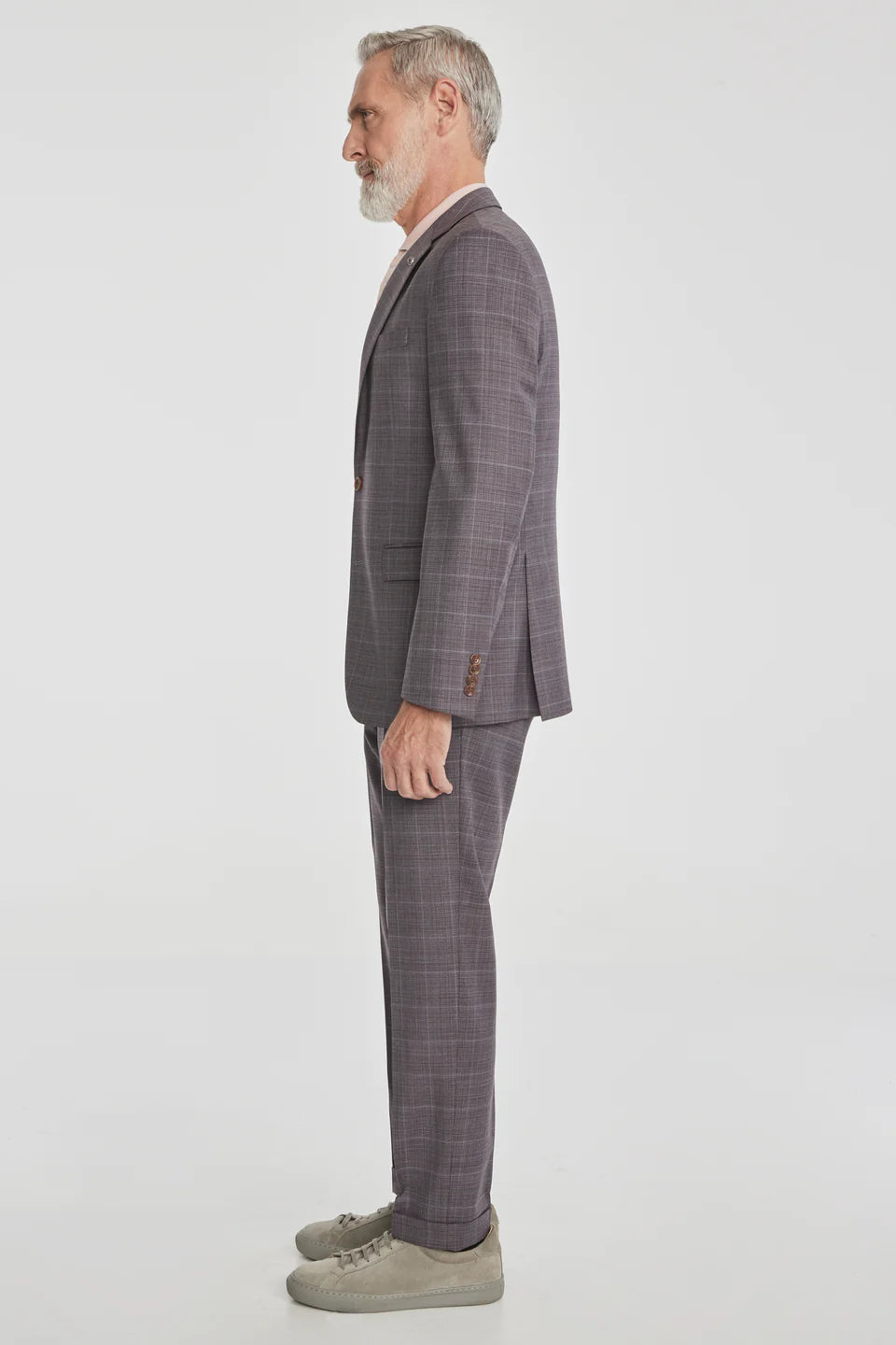This Esprit suit featuring a soft plum tonal windowpane crafted from super 120's wool woven in Italy. The perfect year round weight meets stretch comfort.