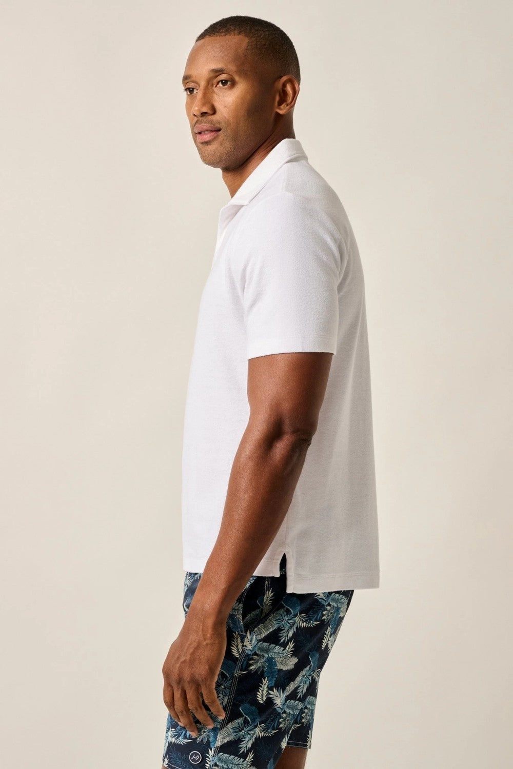 The ultimate poolside style, this terry polo harkens back to the day when lounging under a beach umbrella in the Hollywood Hills was a full-time job. It's made with a lighter version of the fabric used for ultra-luxe towels and it's made with a Johnny collar polo—a mark of the 60s worn by all your favorite style icons.