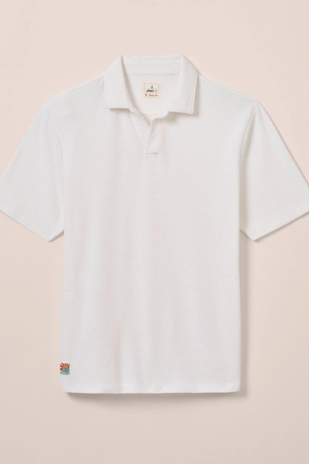 The ultimate poolside style, this terry polo harkens back to the day when lounging under a beach umbrella in the Hollywood Hills was a full-time job. It's made with a lighter version of the fabric used for ultra-luxe towels and it's made with a Johnny collar polo—a mark of the 60s worn by all your favorite style icons.