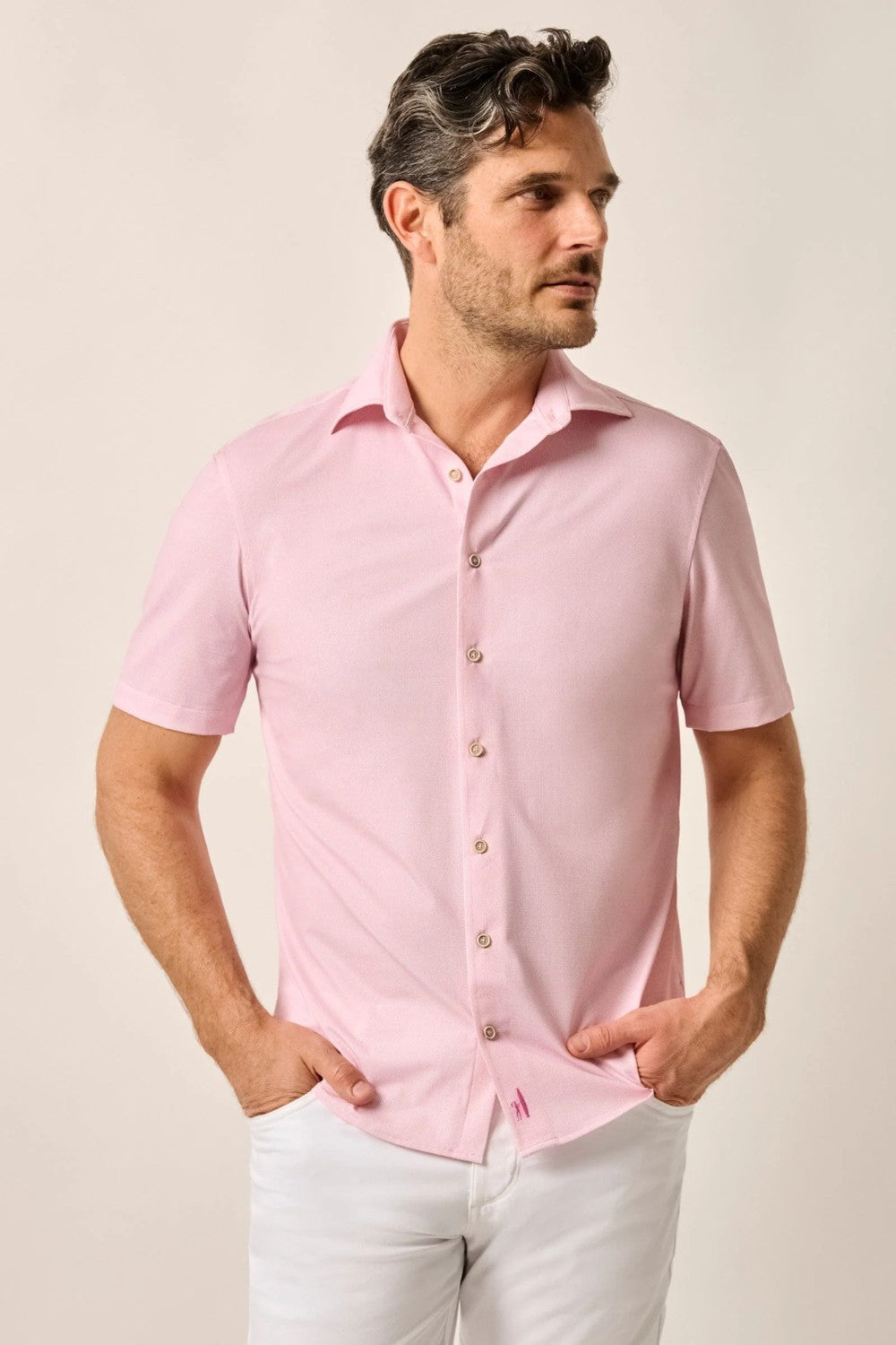 This knit button-up from our Hangin' Out Collection—which is designed to look its best untucked—is made with an incredible soft, and breathable blend of nylon and spandex. This is how you do elevated casual while staying completely comfortable.