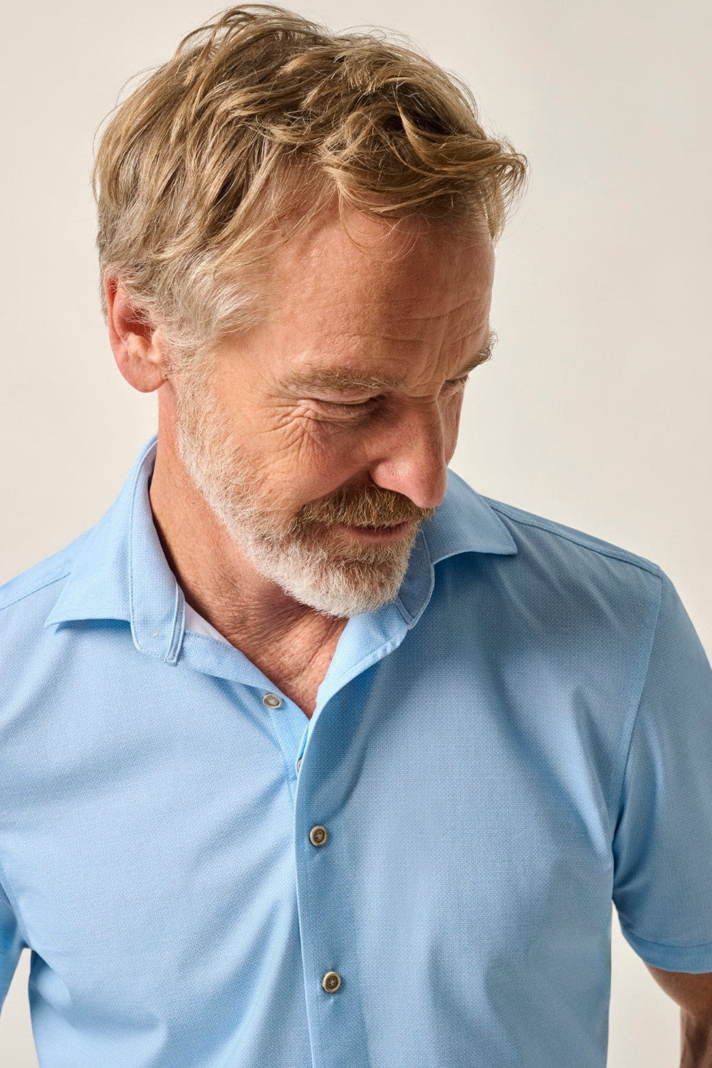 This knit button-up from our Hangin' Out Collection—which is designed to look its best untucked—is made with an incredible soft, and breathable blend of nylon and spandex. This is how you do elevated casual while staying completely comfortable.