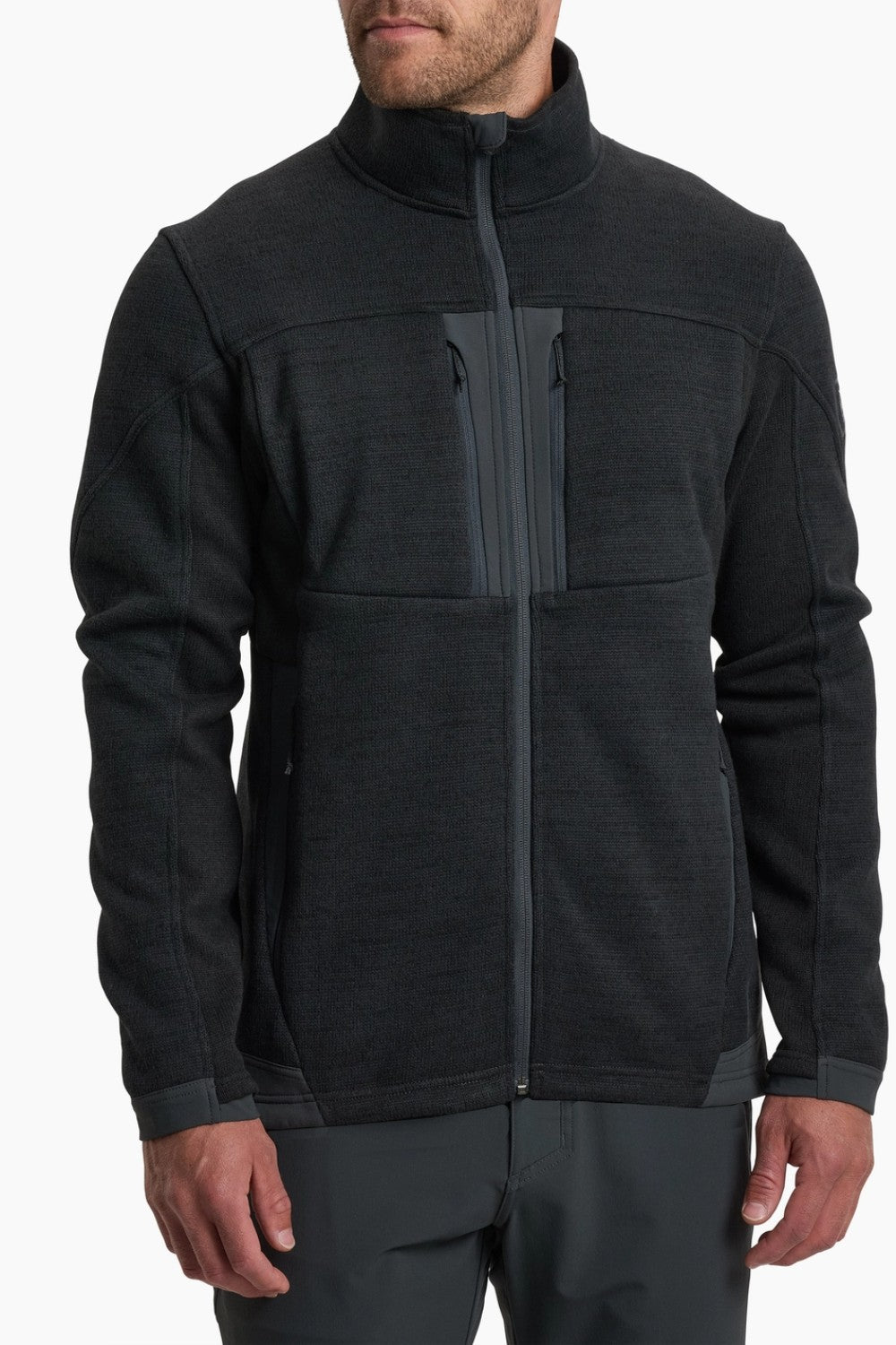 Black fleece jacket worn by a person on a white background