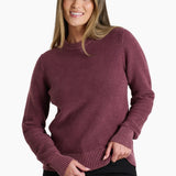 Woman wearing a maroon sweater on a white background
