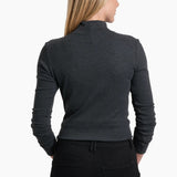 Woman wearing a dark gray long-sleeve top and black pants on a white background